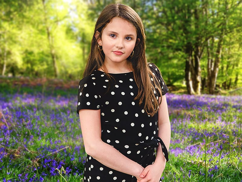 portrait of girl in woodland scene with bluebells by Edinburgh Photographer